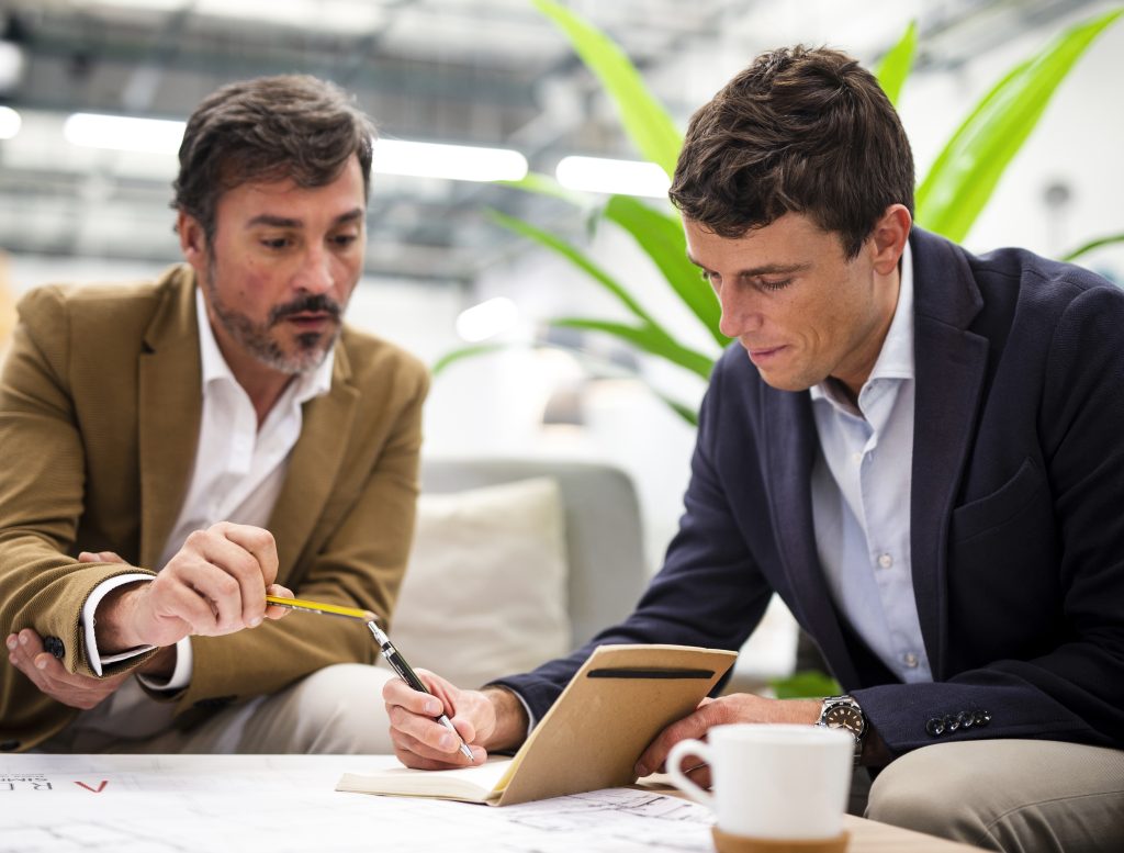 low angle male coworkers meeting office  x