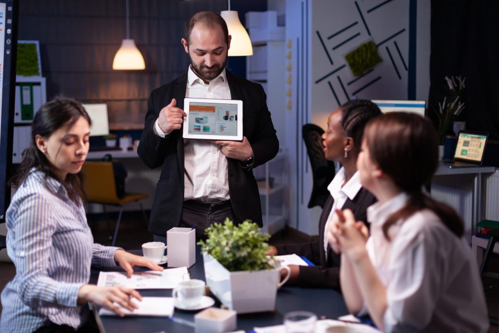 focused businessman showing corporate graphs presentation using tablet working company ideas x